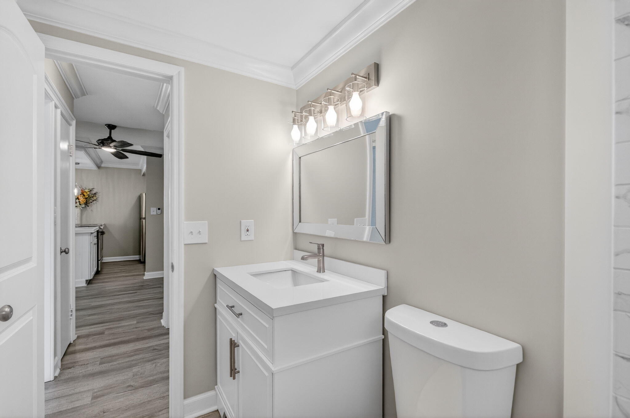 3600 North Ocean Drive, Unit 223 Singer Island, FL 33404 - Photo 18 of 47 a bathroom with a toilet a sink and mirror