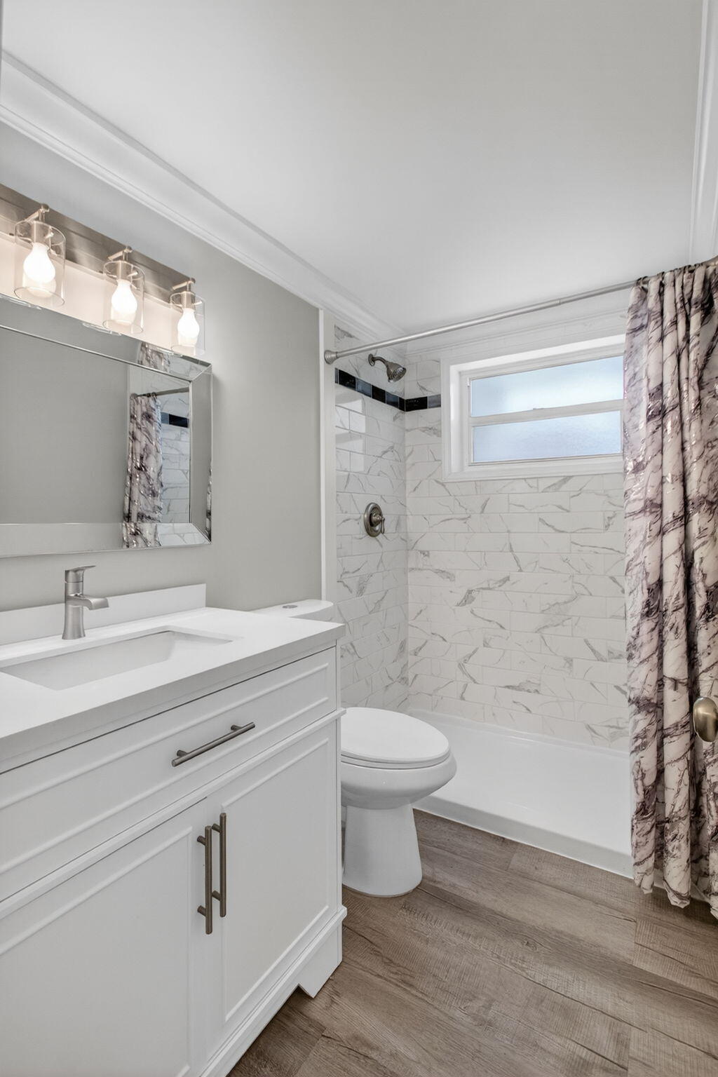 3600 North Ocean Drive, Unit 223 Singer Island, FL 33404 - Photo 19 of 47 a bathroom with a sink a toilet and shower