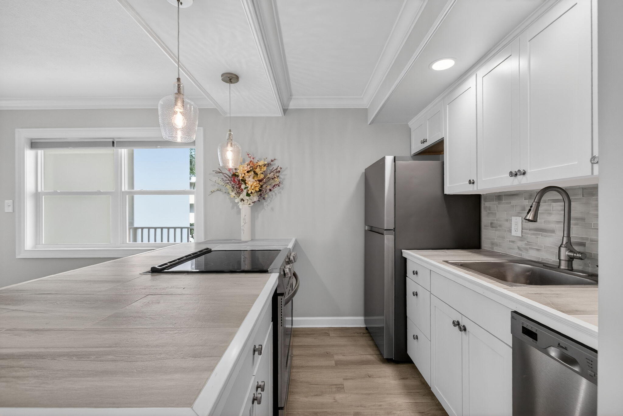 3600 North Ocean Drive, Unit 223 Singer Island, FL 33404 - Photo 2 of 47 a kitchen with a sink stove and refrigerator
