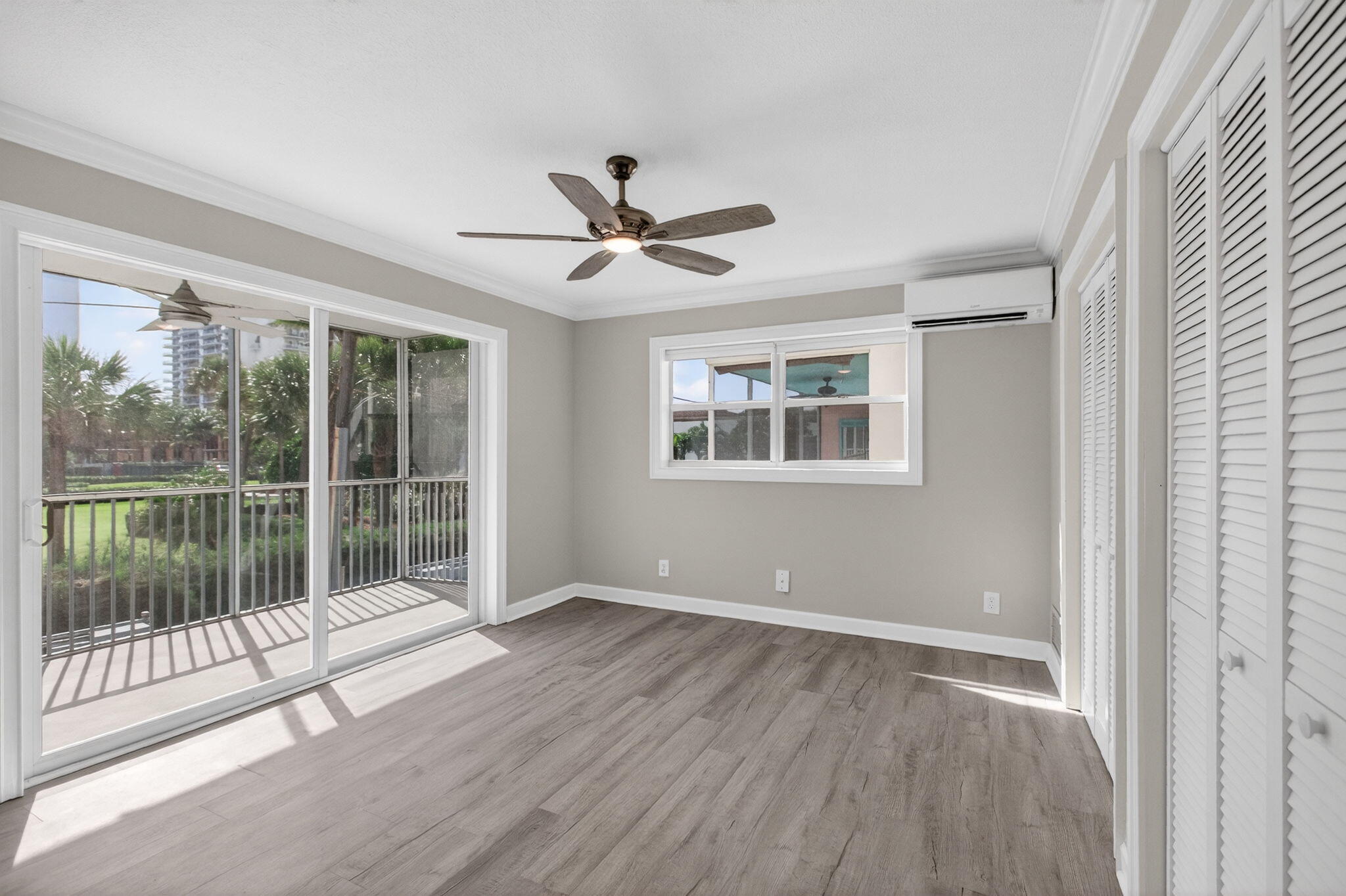 3600 North Ocean Drive, Unit 223 Singer Island, FL 33404 - Photo 21 of 47 a view of empty room with wooden floor and fan