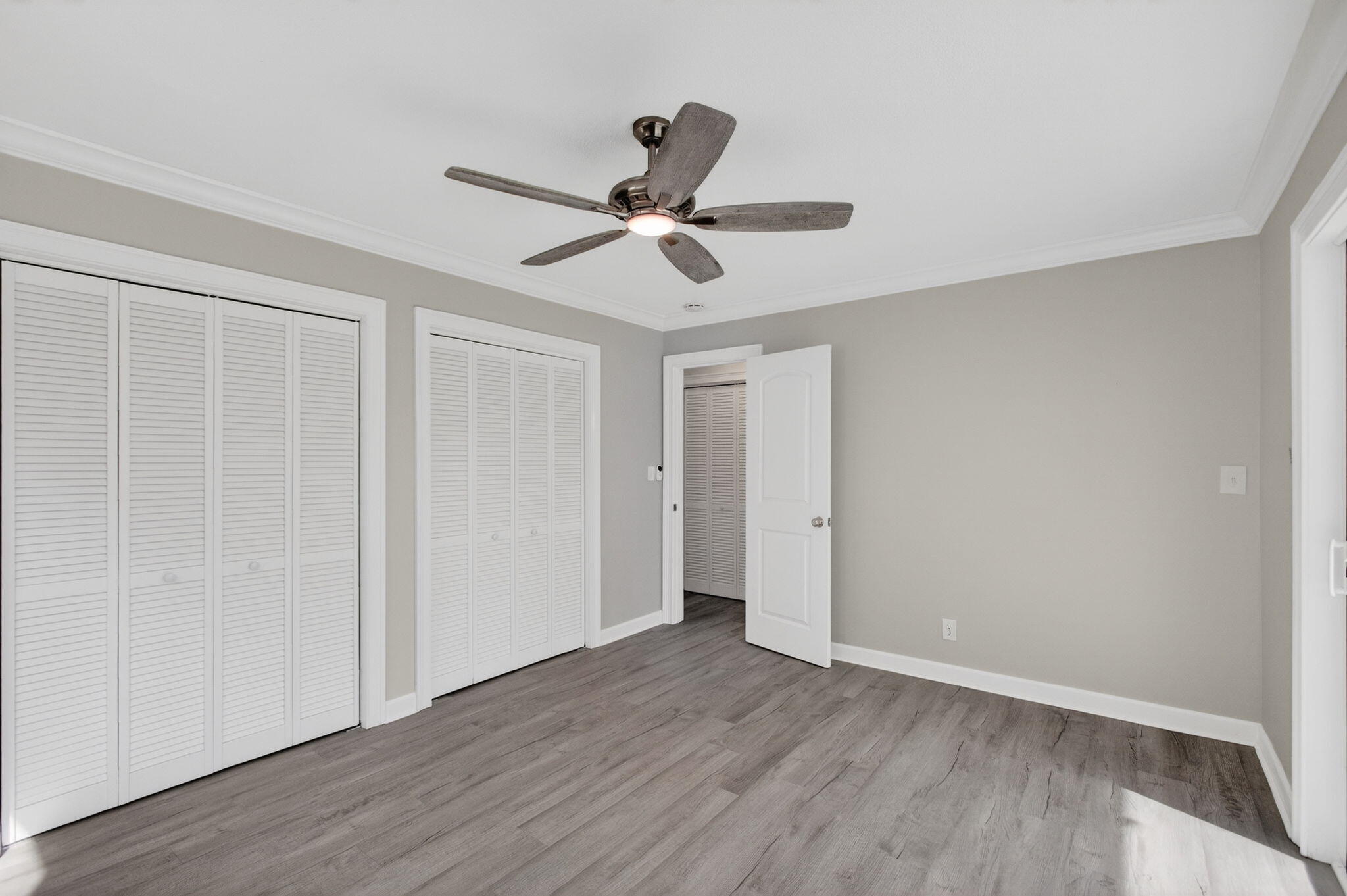 3600 North Ocean Drive, Unit 223 Singer Island, FL 33404 - Photo 25 of 47 a view of a room with wooden floor and a ceiling fan