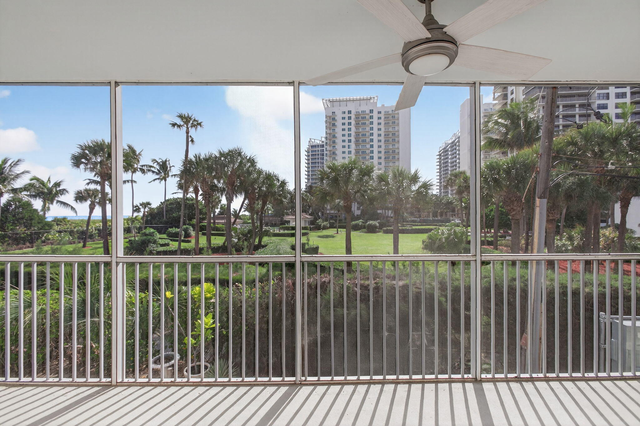 3600 North Ocean Drive, Unit 223 Singer Island, FL 33404 - Photo 27 of 47 a view of a balcony with a floor to ceiling window and wooden fence
