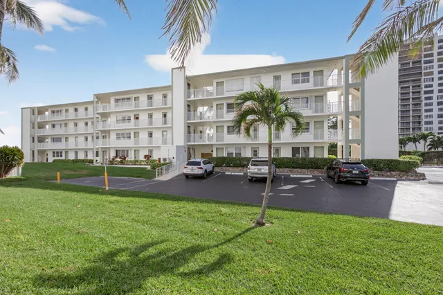 a view of a balcony and yard