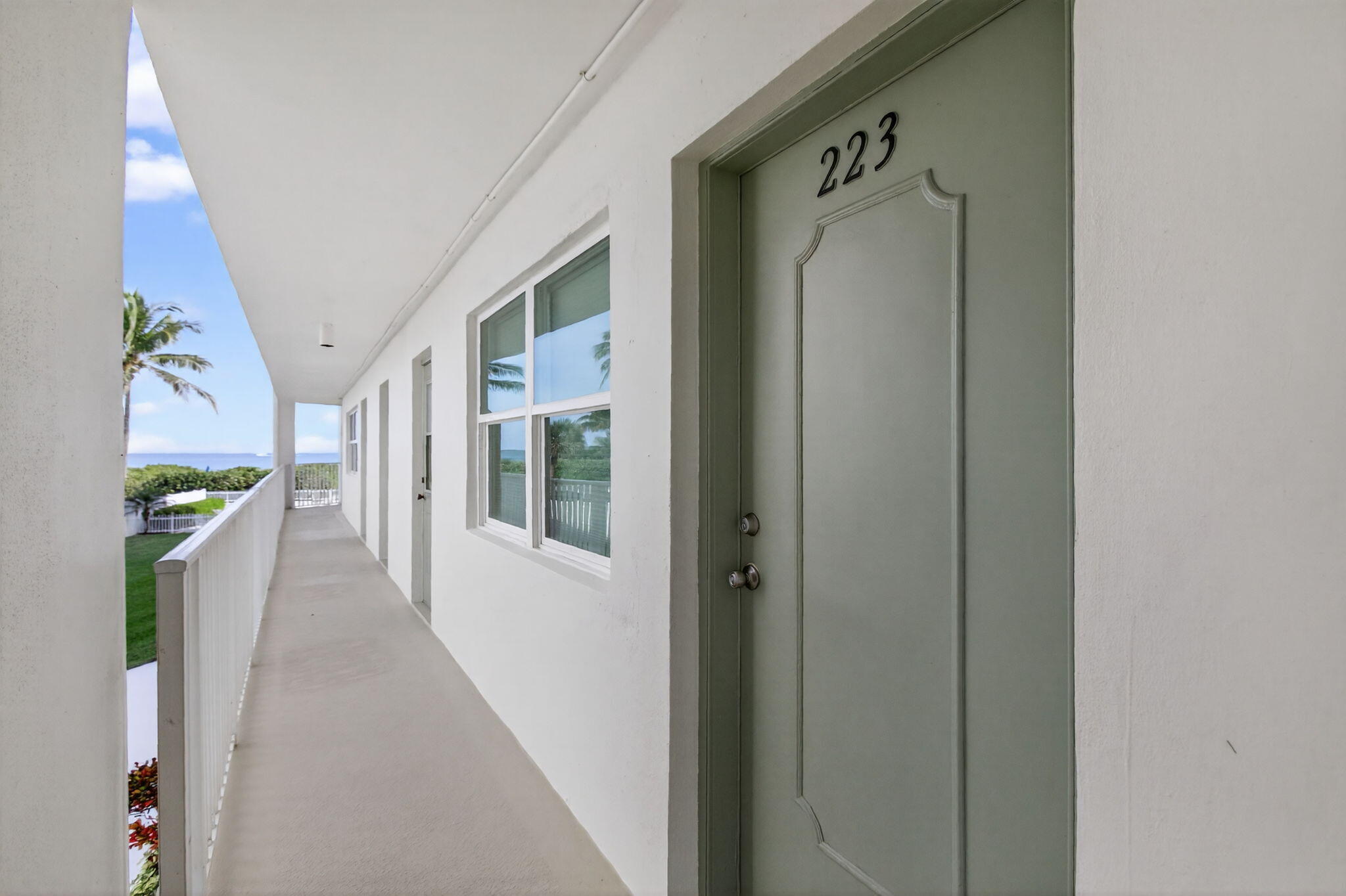 3600 North Ocean Drive, Unit 223 Singer Island, FL 33404 - Photo 33 of 47 a view of a hallway with wooden floor and staircase