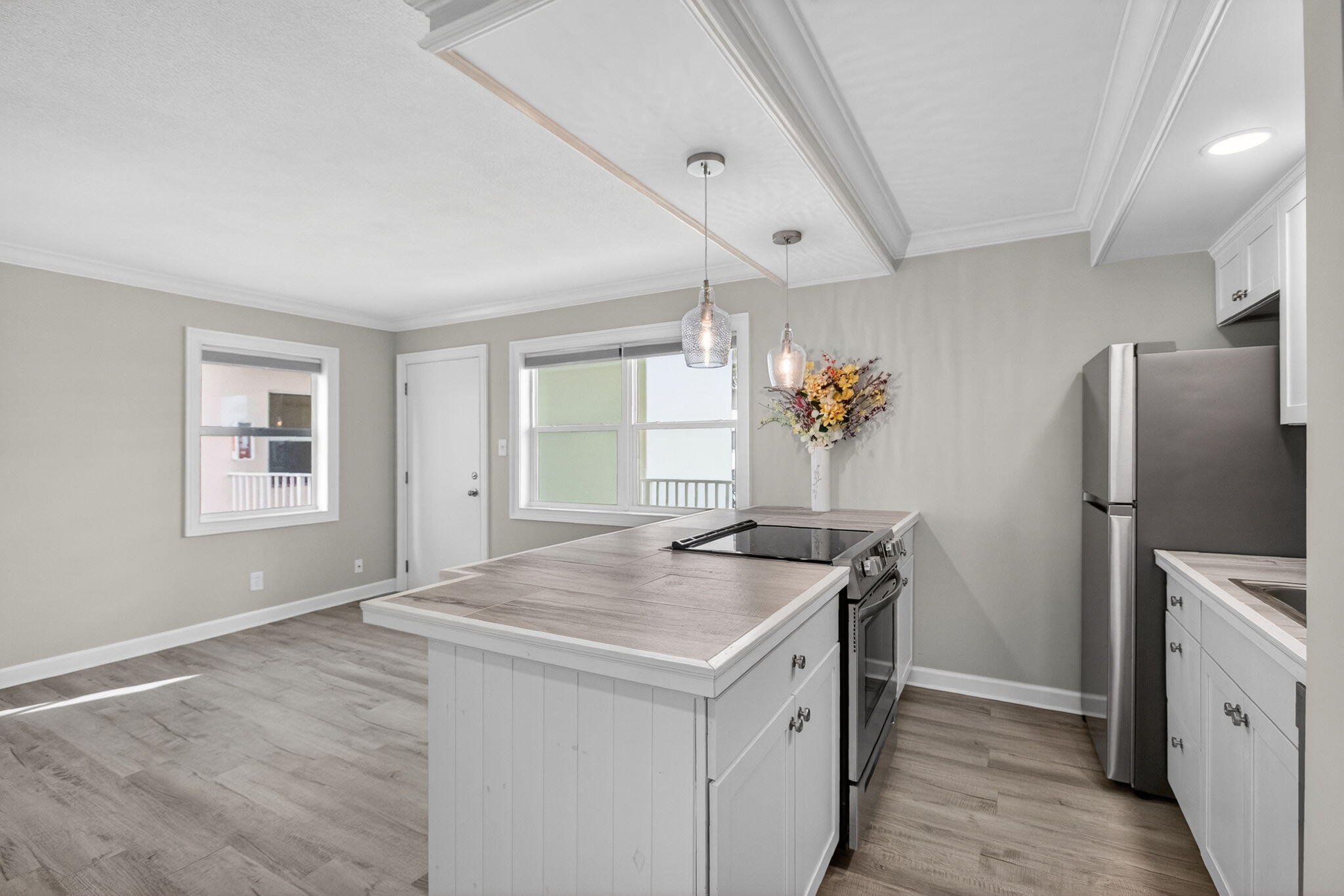3600 North Ocean Drive, Unit 223 Singer Island, FL 33404 - Photo 5 of 47 a kitchen with a stove a refrigerator and a sink