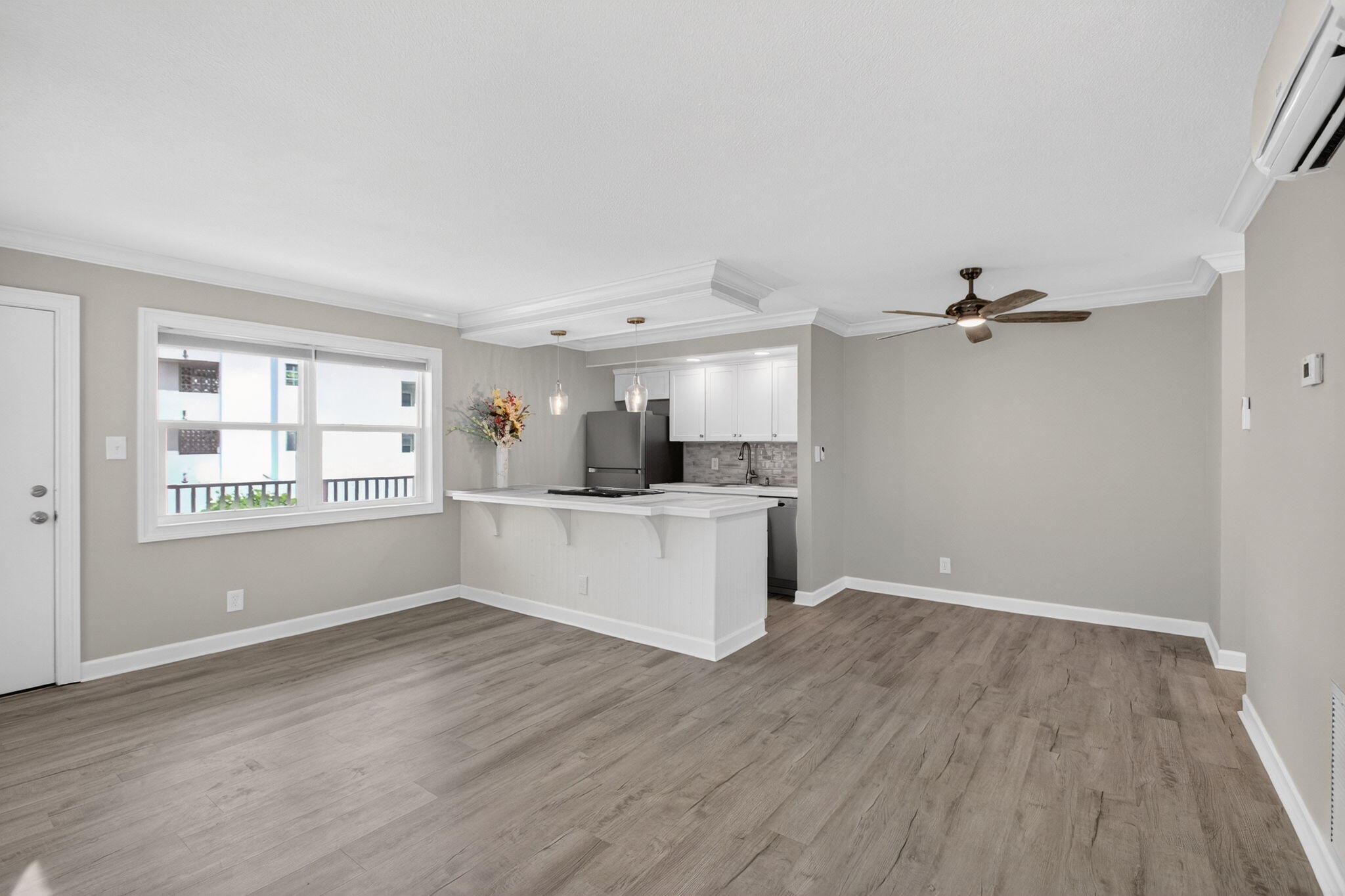 3600 North Ocean Drive, Unit 223 Singer Island, FL 33404 - Photo 7 of 47 a view of a kitchen with wooden floor and a kitchen