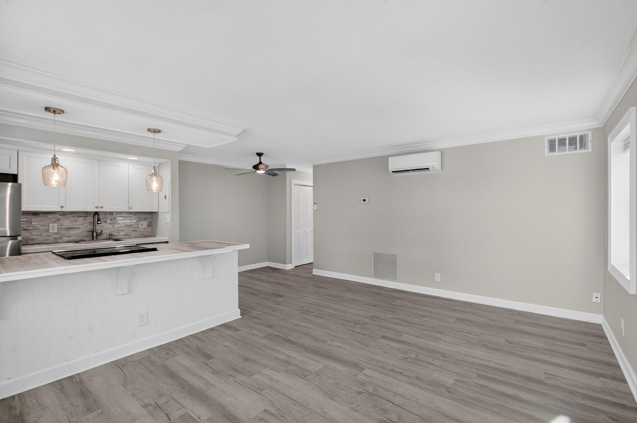 3600 North Ocean Drive, Unit 223 Singer Island, FL 33404 - Photo 9 of 47 a view of a kitchen with a sink and wooden floor