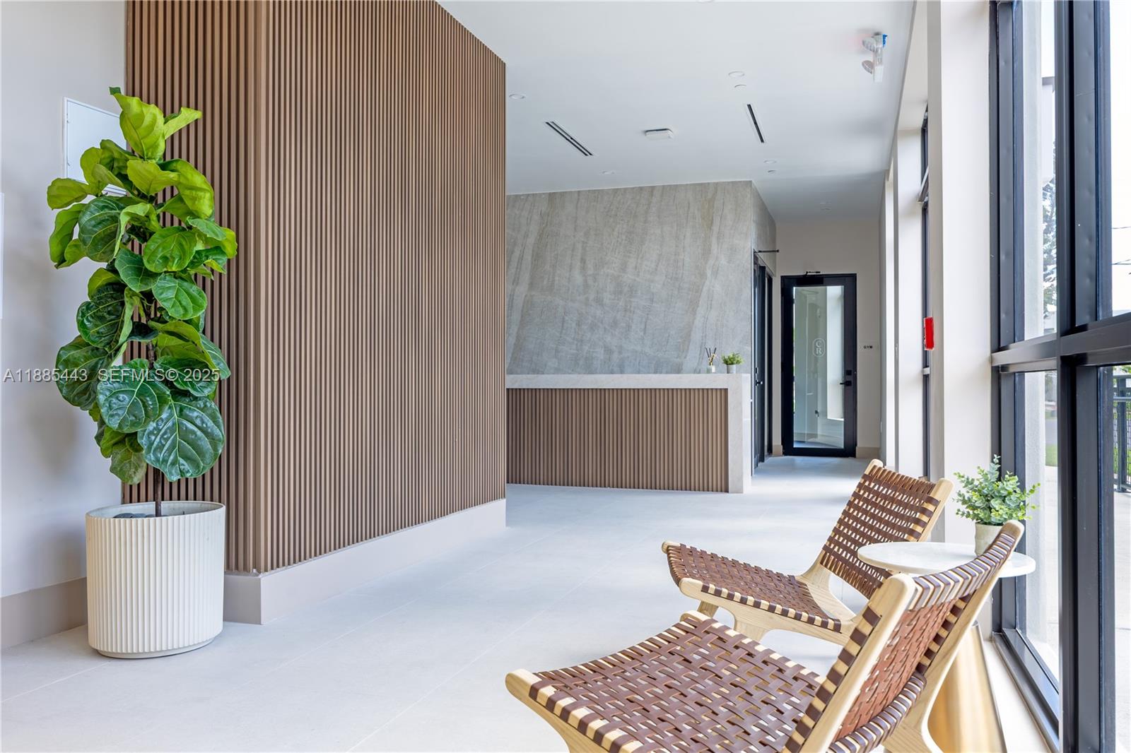 21850 Old Dixie Highway, Unit 1 Miami, FL 33170 - Photo 2 of 13 a living room with furniture and a potted plant