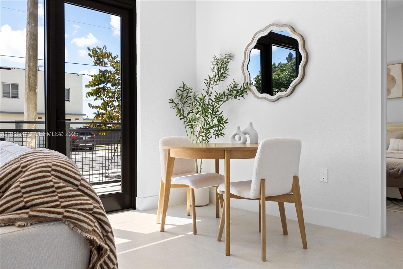 21850 Old Dixie Highway, Unit 1 Miami, FL 33170 - Photo 6 of 13 a view of a livingroom with furniture and a potted plant