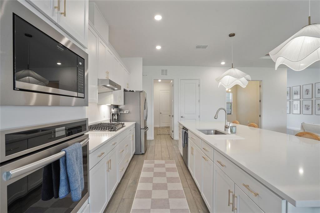 15906 Tradewind Terrace Lakewood Ranch, FL 34211 - Photo 12 of 67 a large white kitchen with a large window