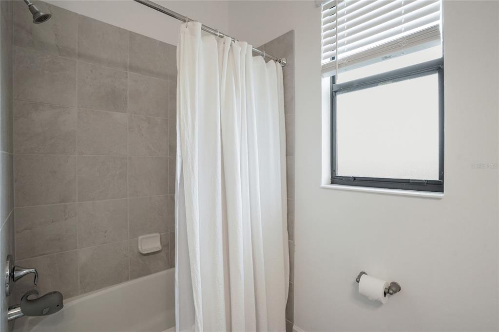 15906 Tradewind Terrace Lakewood Ranch, FL 34211 - Photo 25 of 67 a bathroom with a shower and a tub