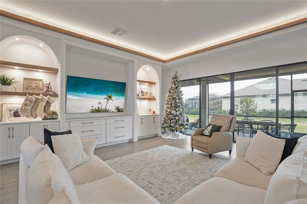 15906 Tradewind Terrace Lakewood Ranch, FL 34211 - Photo 3 of 67 a living room with furniture and a large window