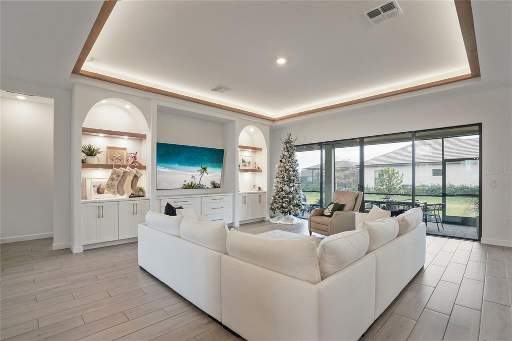 15906 Tradewind Terrace Lakewood Ranch, FL 34211 - Photo 5 of 67 a living room with furniture and a large window