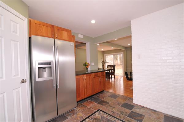 28 Hardwick Road Natick, MA 01760 - Photo 12 of 30 a kitchen with stainless steel appliances granite countertop a refrigerator and a sink