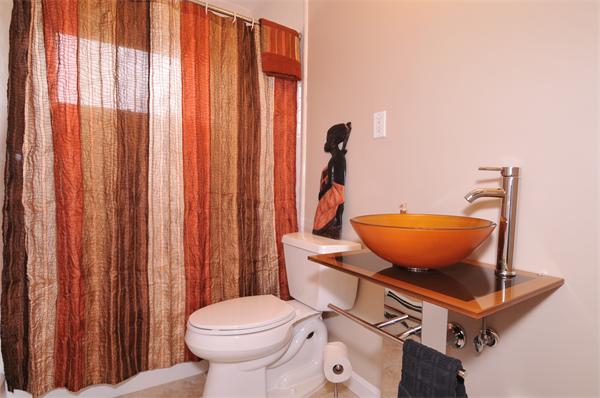 28 Hardwick Road Natick, MA 01760 - Photo 15 of 30 a bathroom with a toilet a sink and a mirror