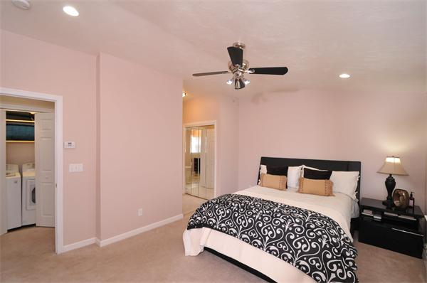 28 Hardwick Road Natick, MA 01760 - Photo 21 of 30 a bedroom with a bed and a chandelier