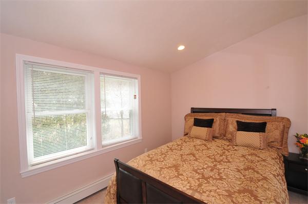 28 Hardwick Road Natick, MA 01760 - Photo 27 of 30 a bedroom with a large bed and a window