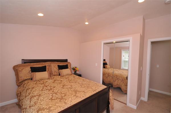 28 Hardwick Road Natick, MA 01760 - Photo 28 of 30 a bedroom with a bed and lamp