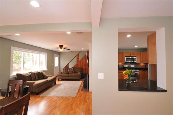 28 Hardwick Road Natick, MA 01760 - Photo 4 of 30 a living room with furniture and a flat screen tv