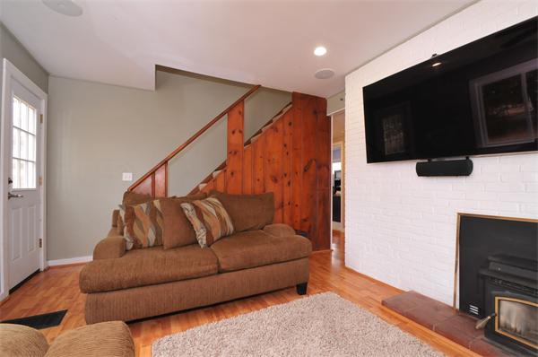 28 Hardwick Road Natick, MA 01760 - Photo 6 of 30 a living room with furniture and a flat screen tv