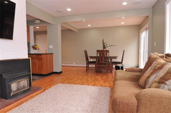 28 Hardwick Road Natick, MA 01760 - Photo 7 of 30 a living room with furniture and a flat screen tv