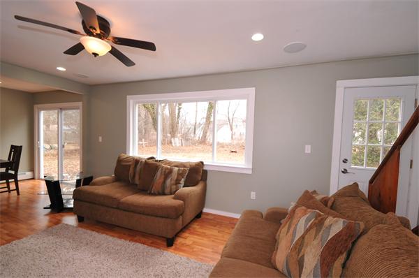 28 Hardwick Road Natick, MA 01760 - Photo 8 of 30 a living room with furniture and a large window