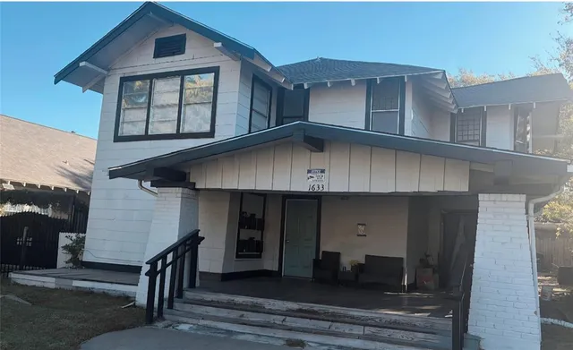 a front view of a house with a garage