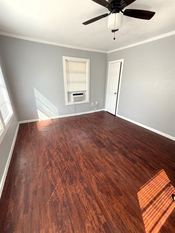 1633 Washington Avenue Fort Worth, TX 76104 - Photo 4 of 5 wooden floor in an empty room with a window