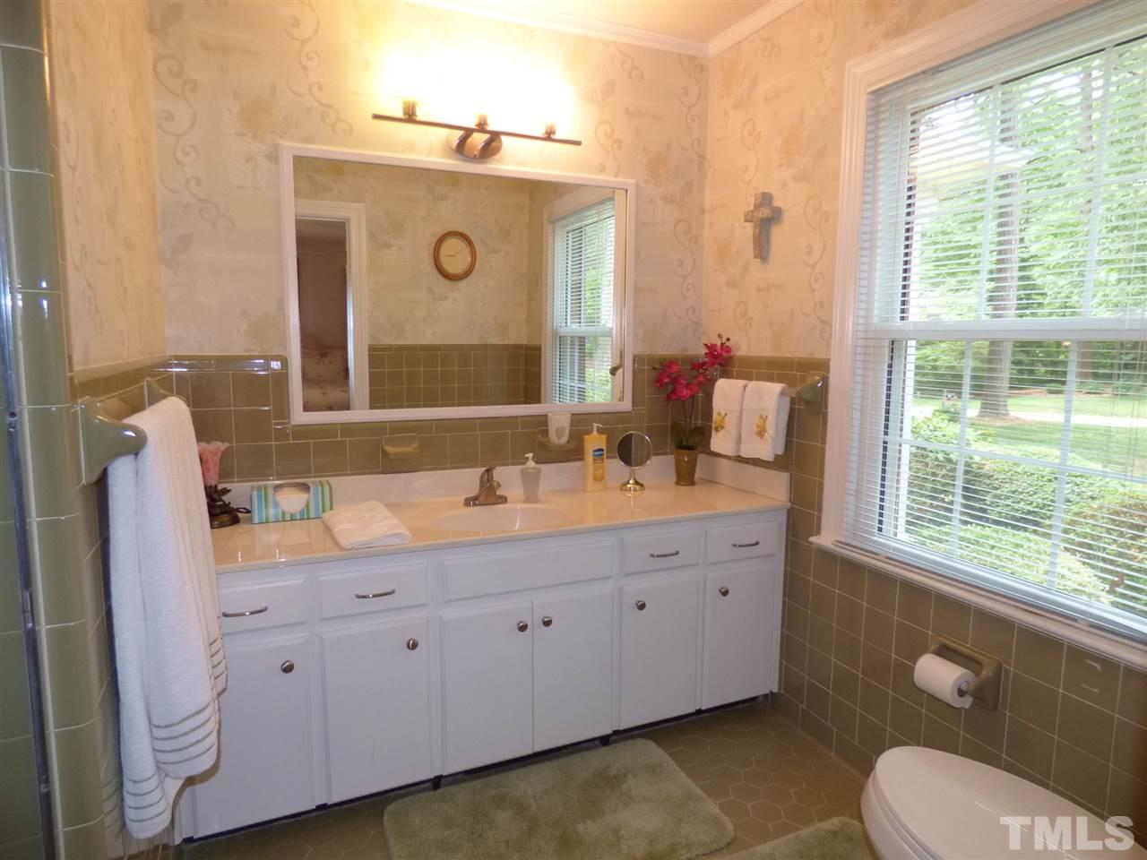3117 Cartwright Drive Raleigh, NC 27612 - Photo 14 of 25 a bathroom with a granite countertop sink mirror and a toilet