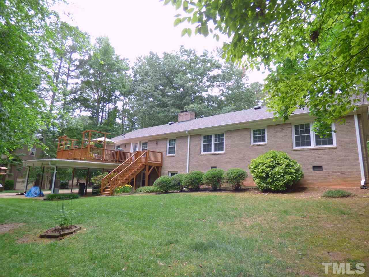 3117 Cartwright Drive Raleigh, NC 27612 - Photo 22 of 25 a view of a house with a backyard