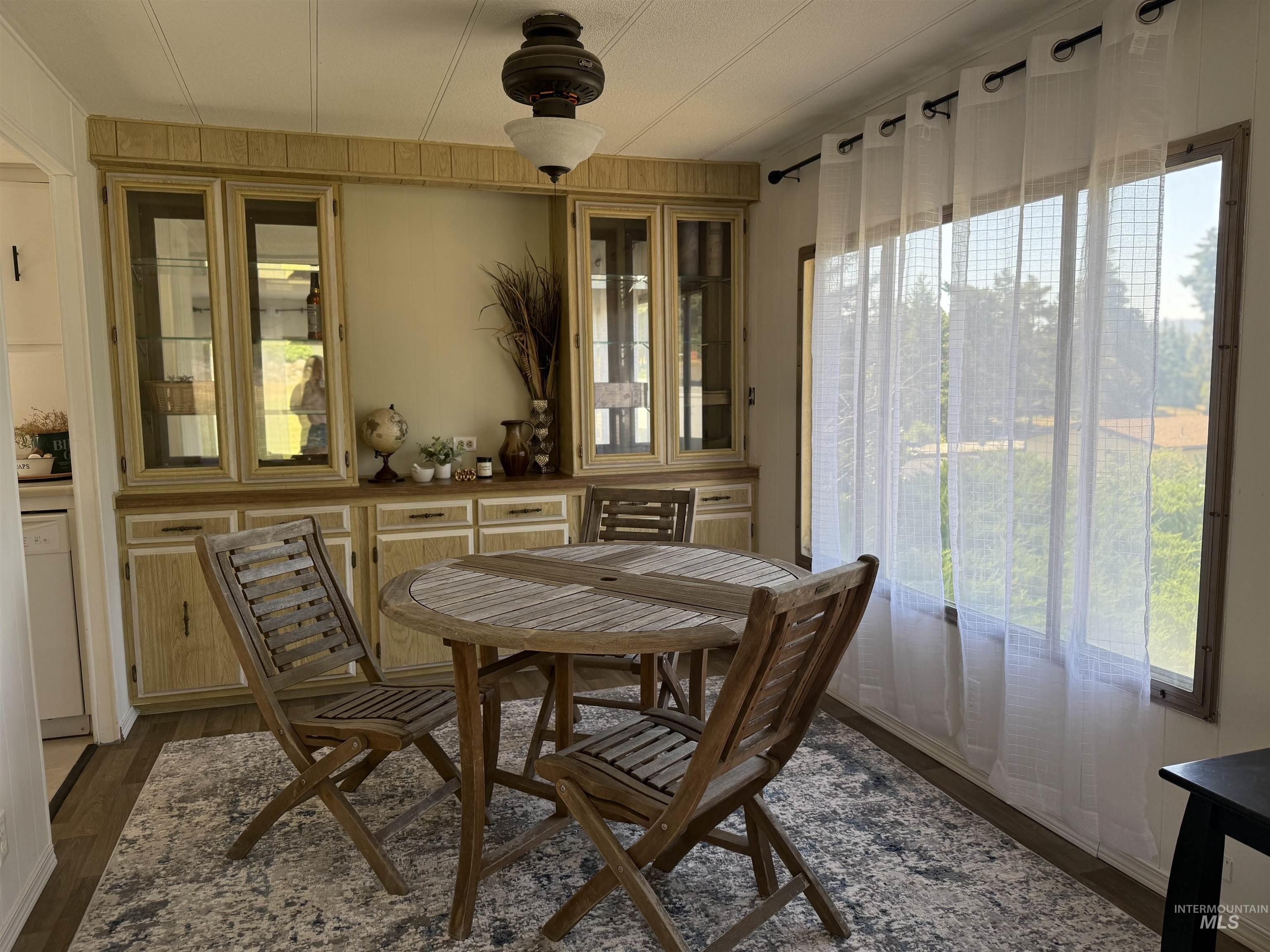 605 North Almon Street, Unit 44 Moscow, ID 83843 - Photo 11 of 34 Dining area with healthy amount of natural light and dark wood-type flooring