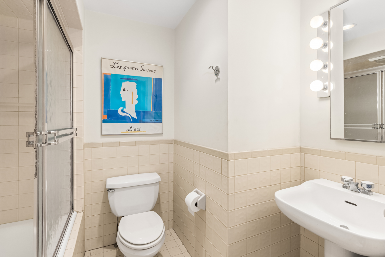 48 East 83rd Street, Unit GARDEN Manhattan, NY 10028 - Photo 15 of 16 a bathroom with a toilet sink and mirror