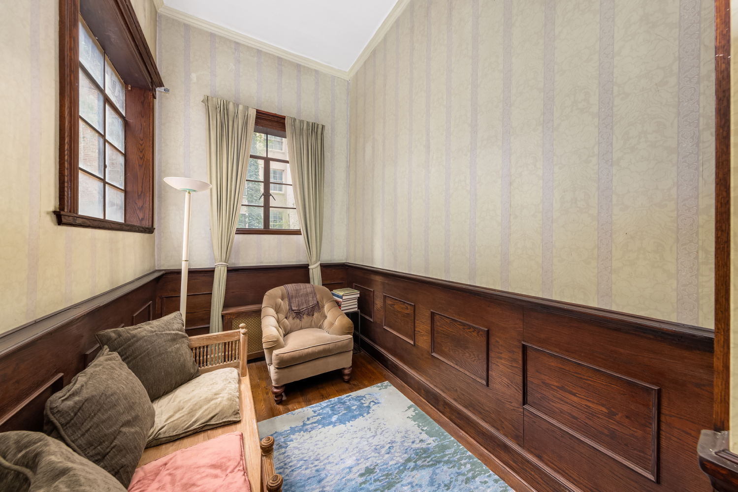 48 East 83rd Street, Unit GARDEN Manhattan, NY 10028 - Photo 10 of 16 a living room with furniture and a window