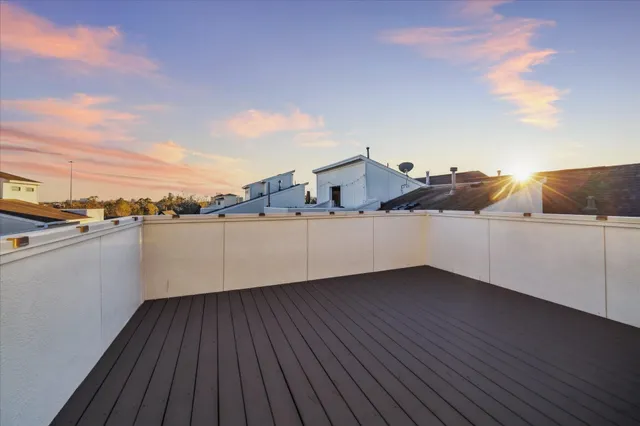 a view of a terrace with wooden floor