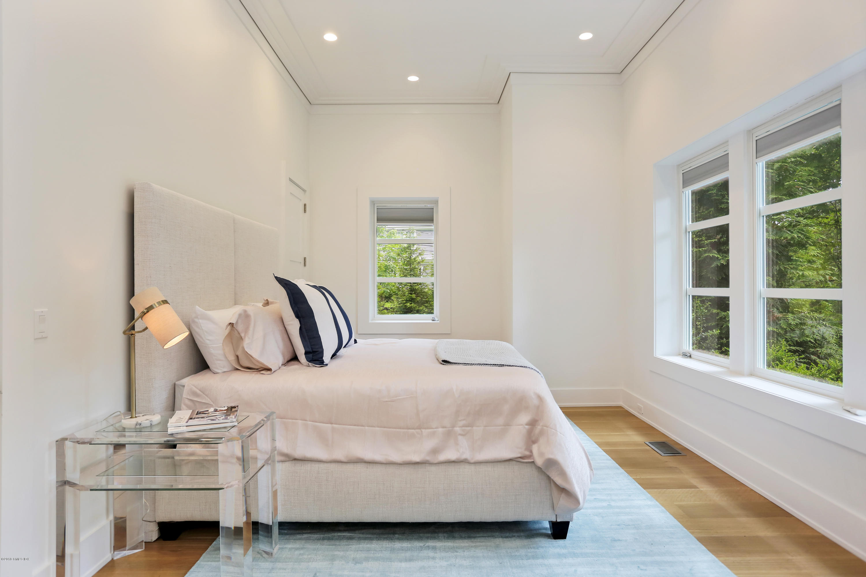 22 Oak Drive Riverside, CT 06878 - Photo 12 of 32 a bedroom with bed and window