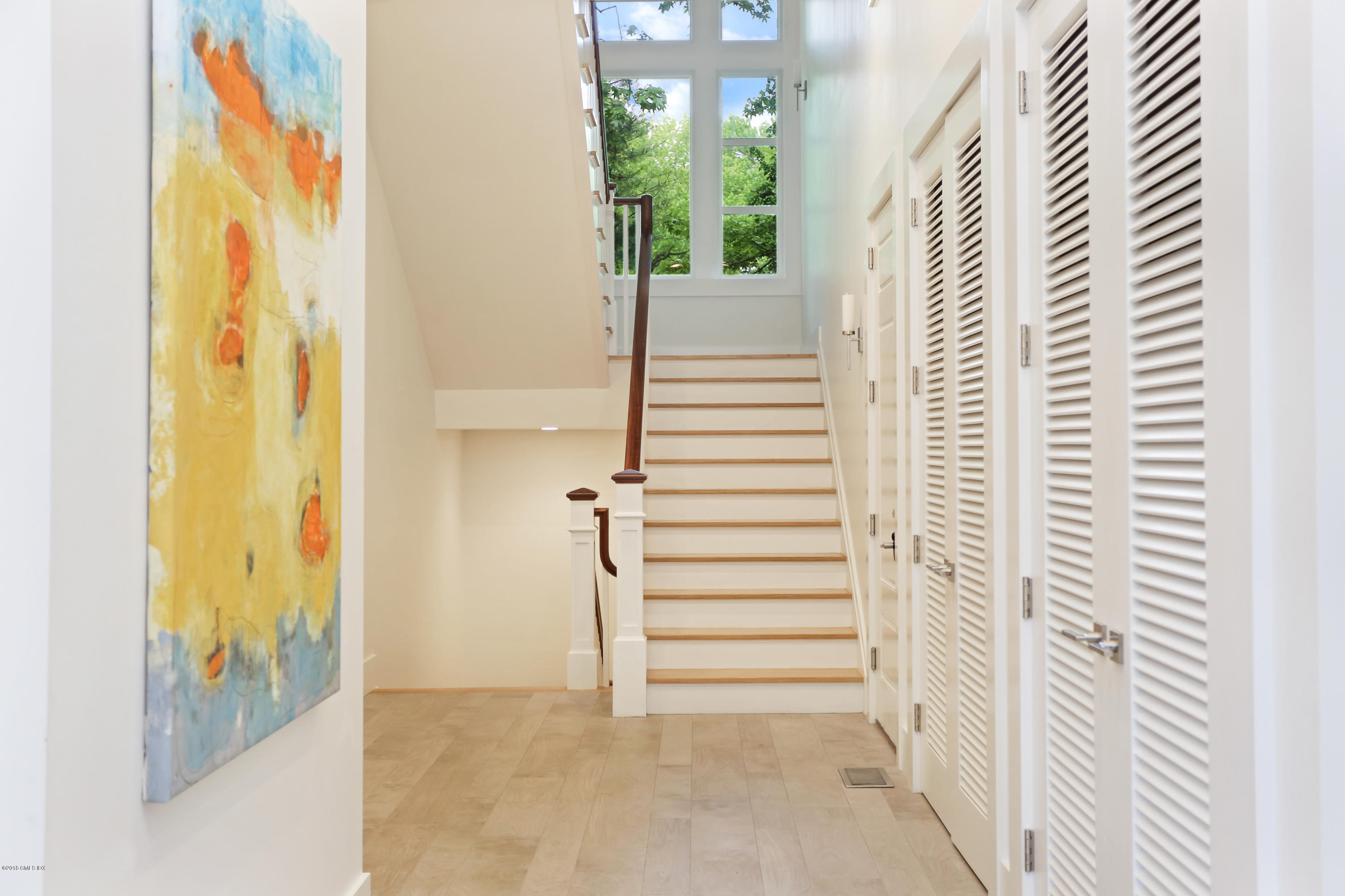 22 Oak Drive Riverside, CT 06878 - Photo 14 of 32 a view of a hallway with wooden floor and windows