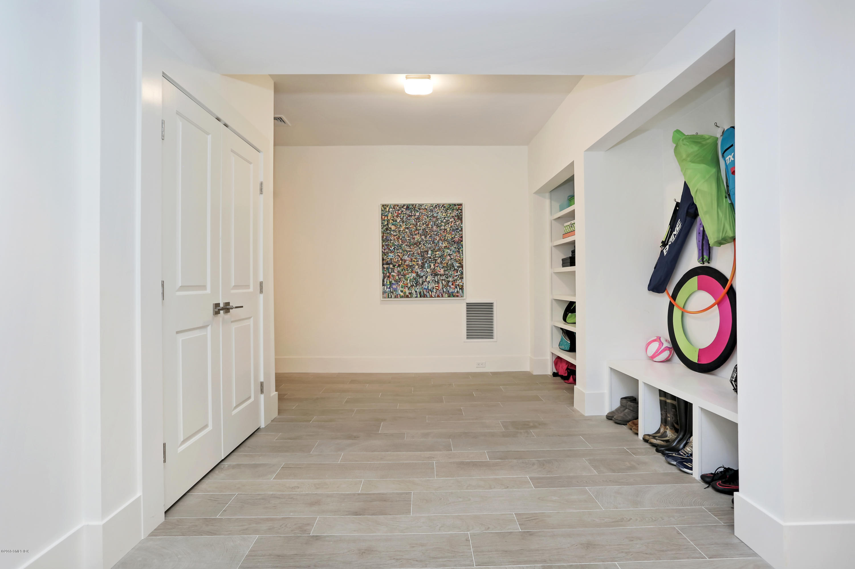 22 Oak Drive Riverside, CT 06878 - Photo 18 of 32 a view of a hallway with wooden floor and entryway