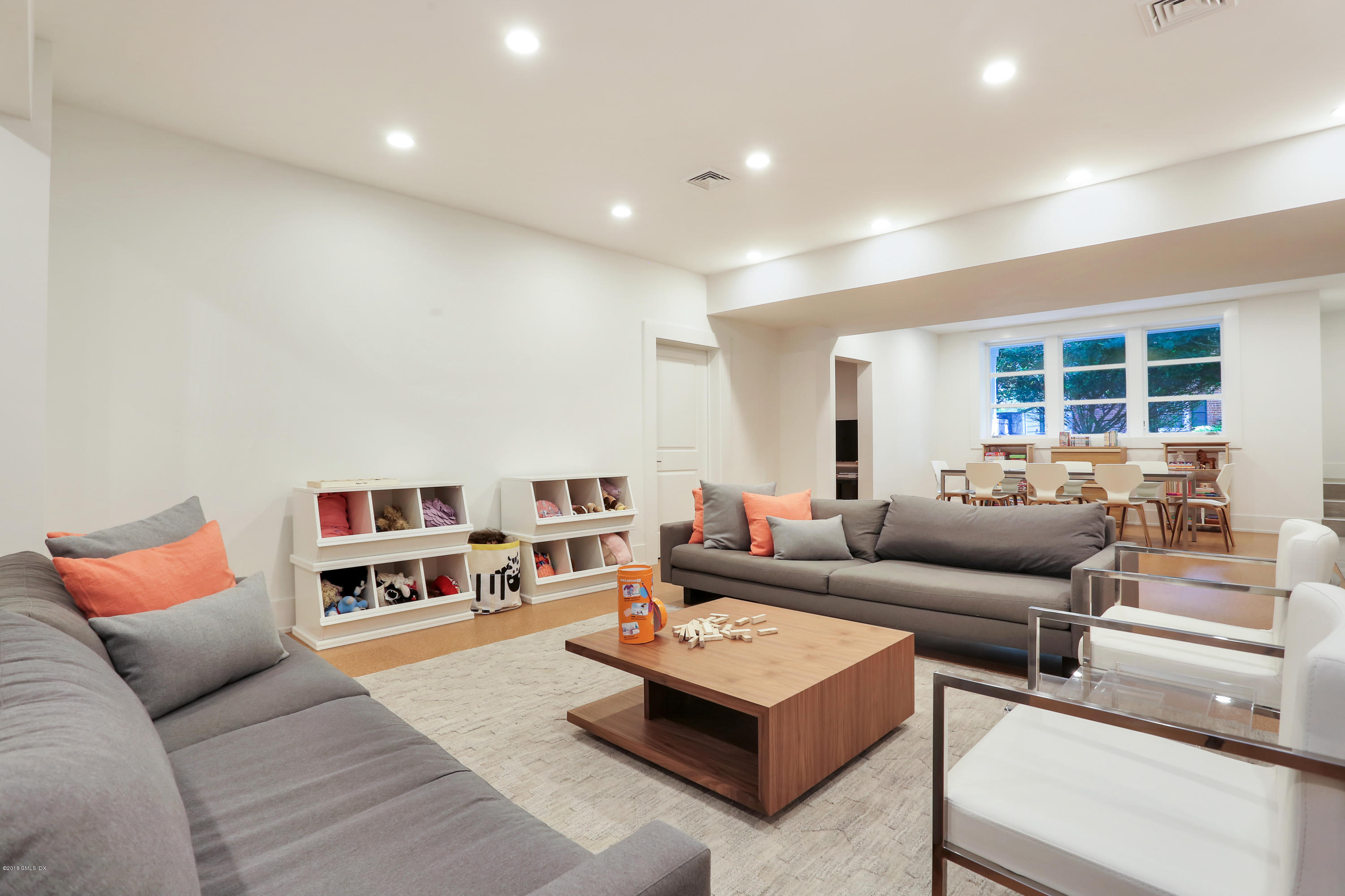 22 Oak Drive Riverside, CT 06878 - Photo 19 of 32 a living room with furniture and a book shelf