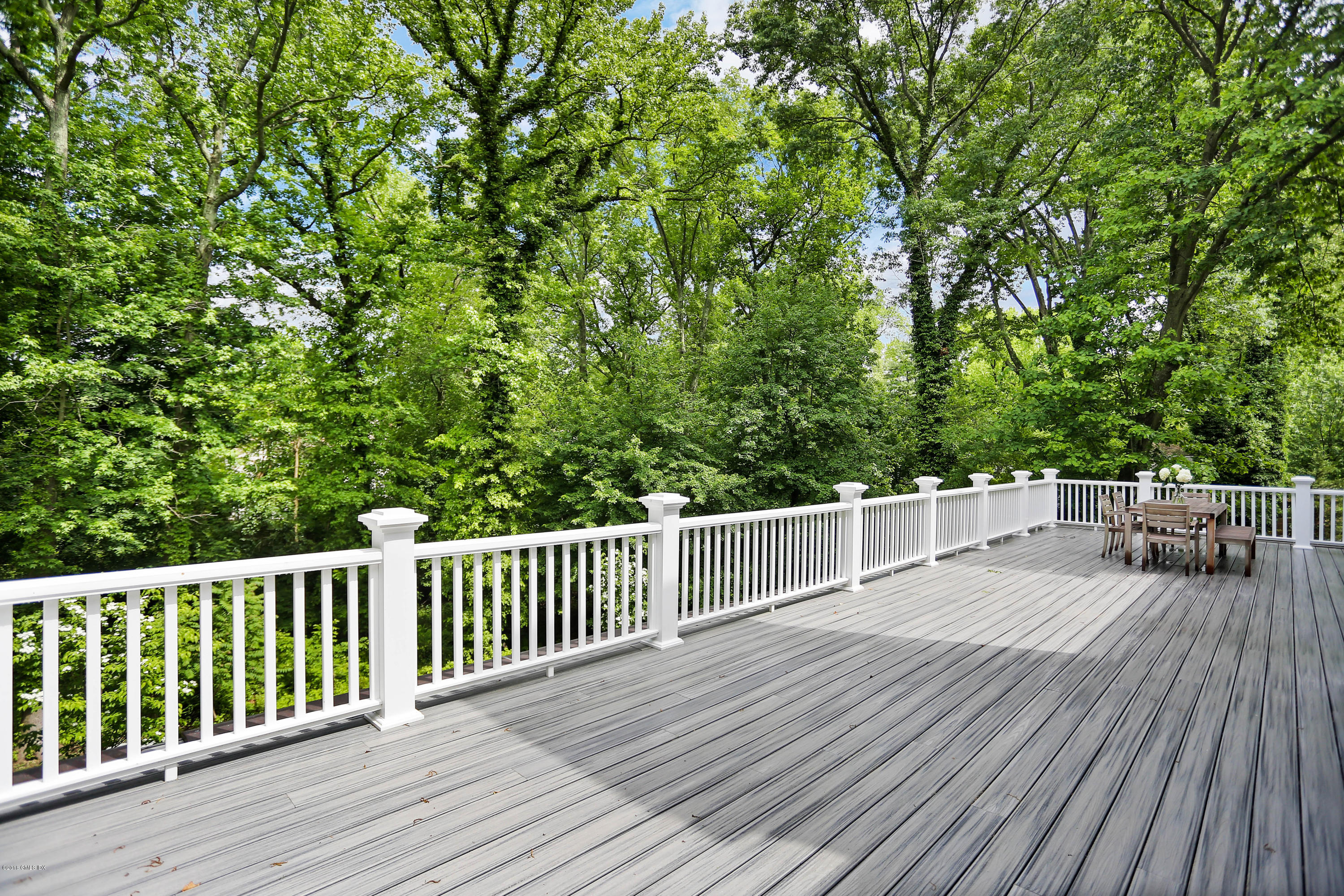 22 Oak Drive Riverside, CT 06878 - Photo 24 of 32 a view of a roof deck with wooden floor and fence