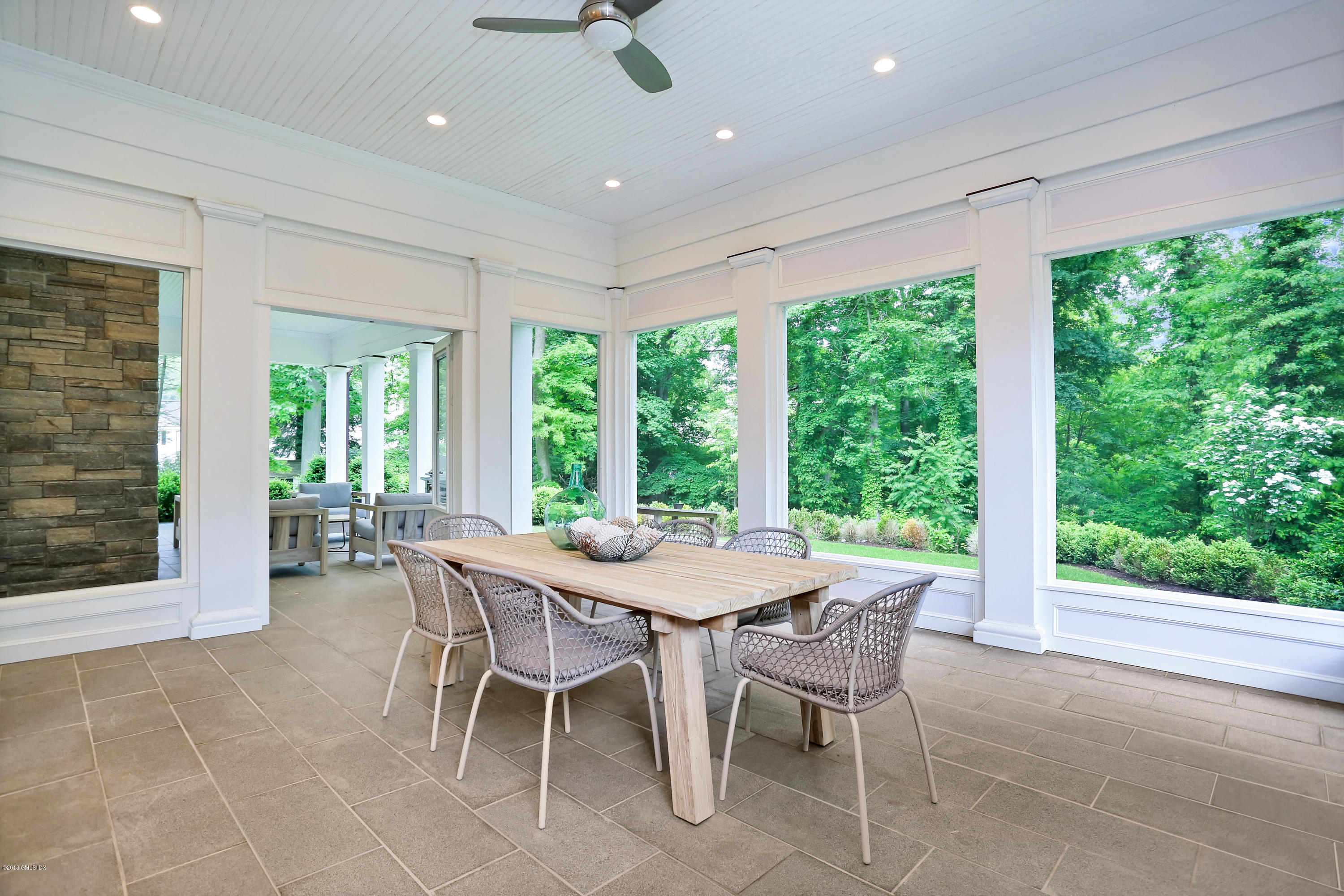 22 Oak Drive Riverside, CT 06878 - Photo 26 of 32 a dining room with furniture and a floor to ceiling window