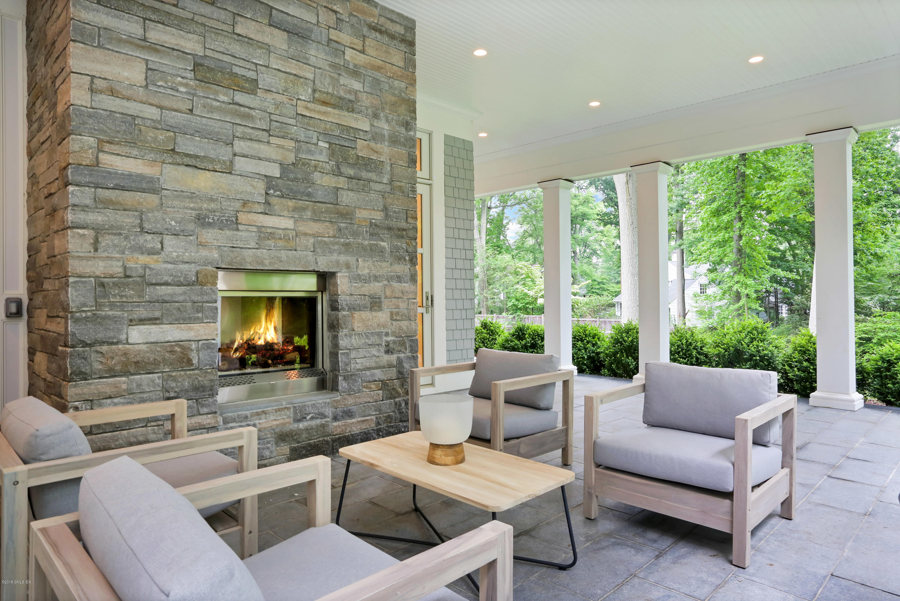 22 Oak Drive Riverside, CT 06878 - Photo 27 of 32 a living room with fireplace furniture and a flat screen tv