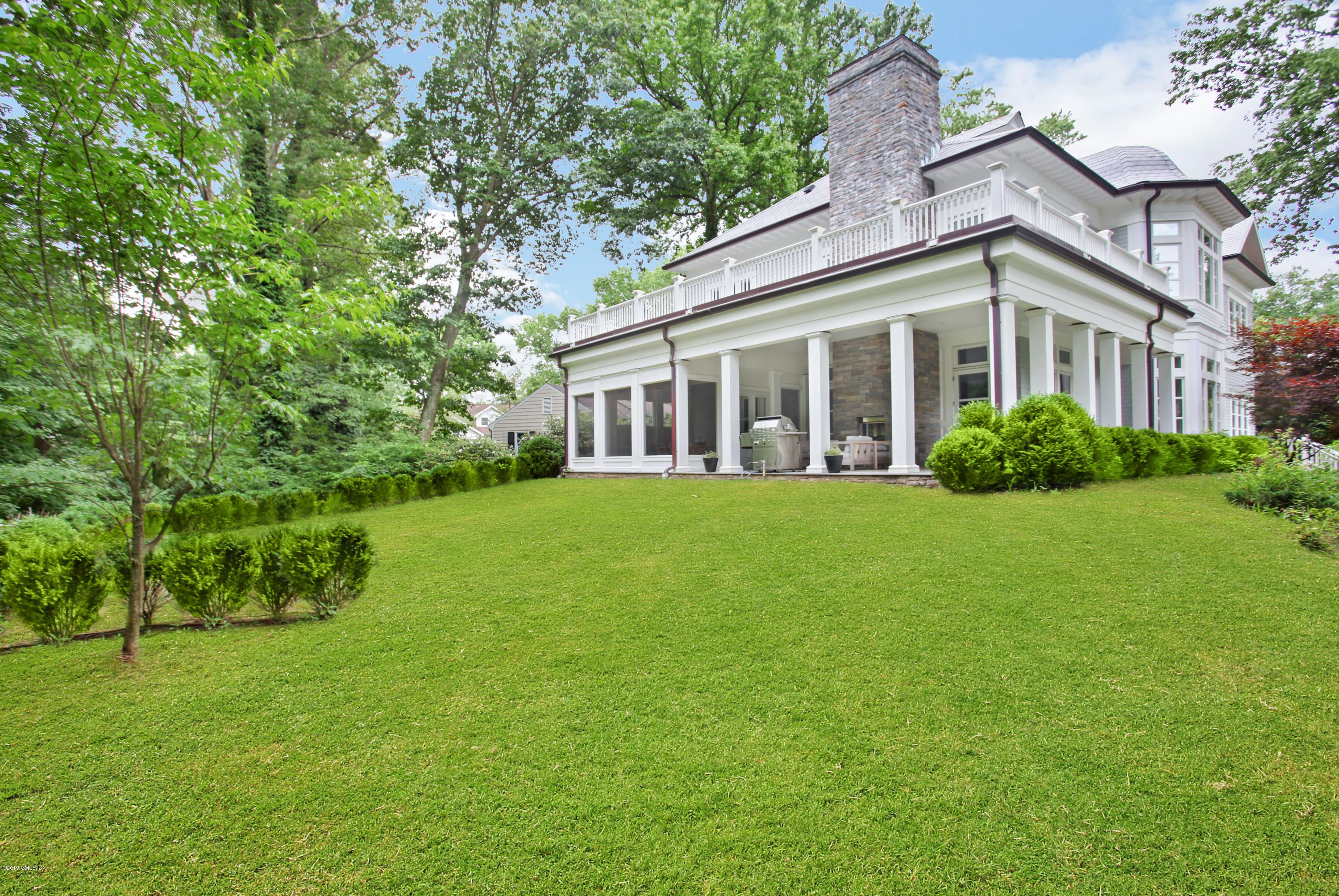 22 Oak Drive Riverside, CT 06878 - Photo 28 of 32 a view of a house next to a big yard and large trees