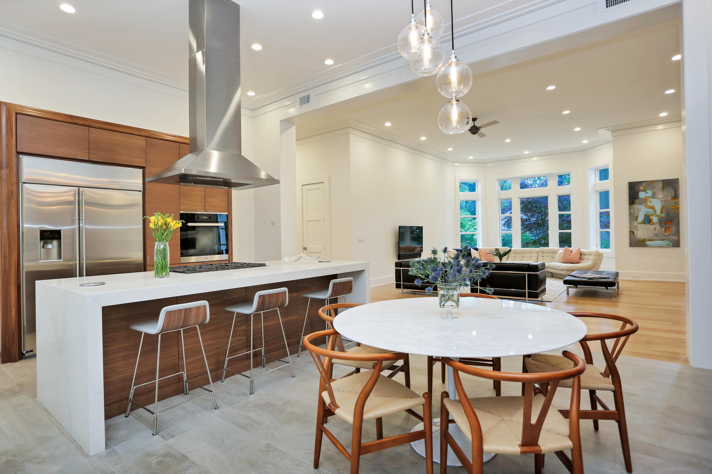 22 Oak Drive Riverside, CT 06878 - Photo 3 of 32 a kitchen with a table and chairs in it