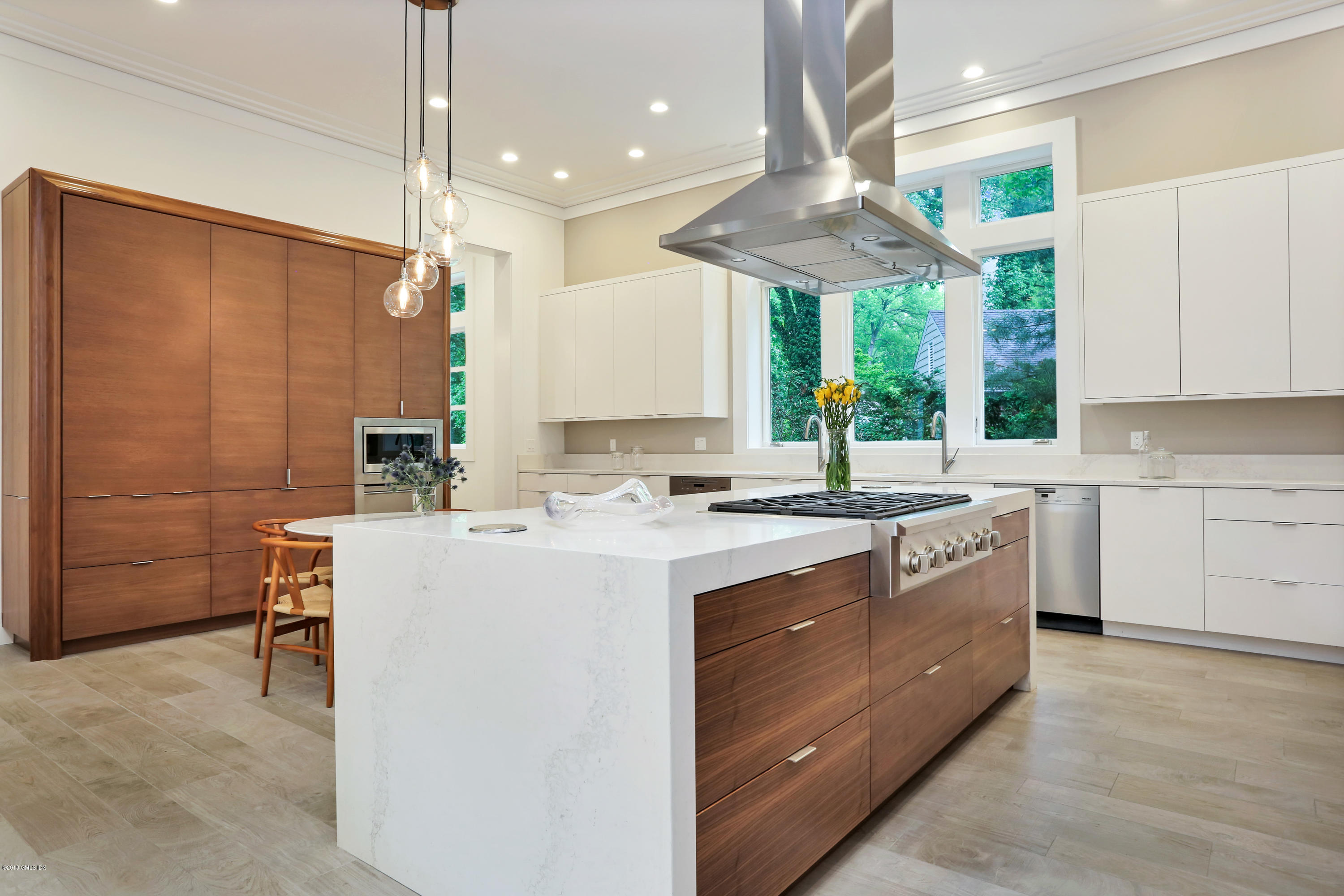 22 Oak Drive Riverside, CT 06878 - Photo 4 of 32 a kitchen with kitchen island granite countertop a sink a counter top space appliances and cabinets
