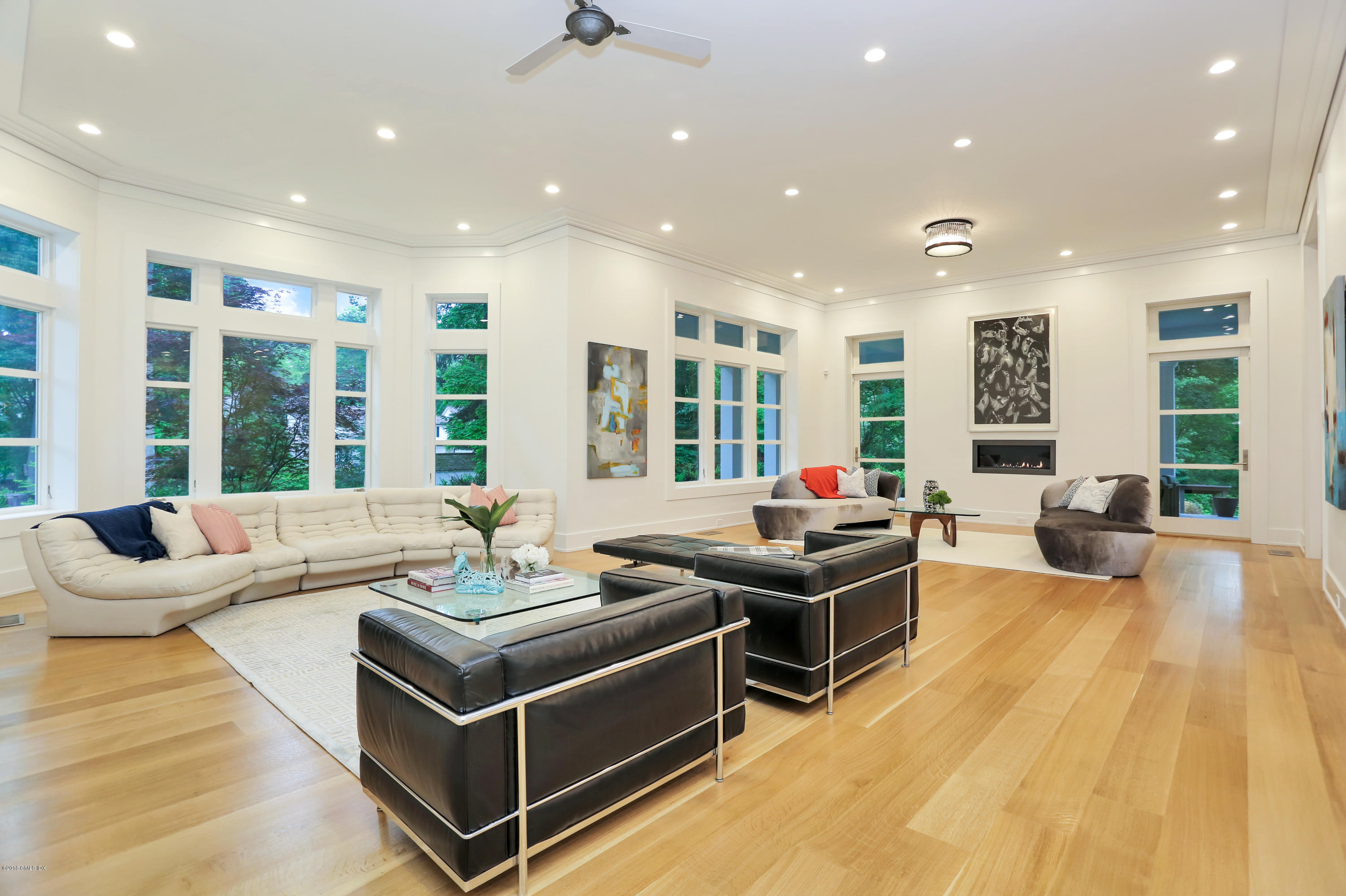 22 Oak Drive Riverside, CT 06878 - Photo 7 of 32 a living room with furniture and large windows