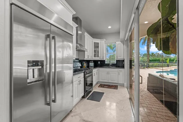 a bathroom with a double vanity sink mirror and shower