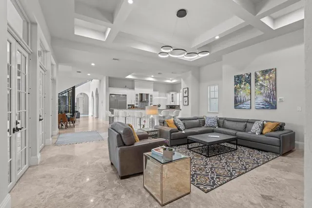 an aerial view of residential houses with outdoor space and trees