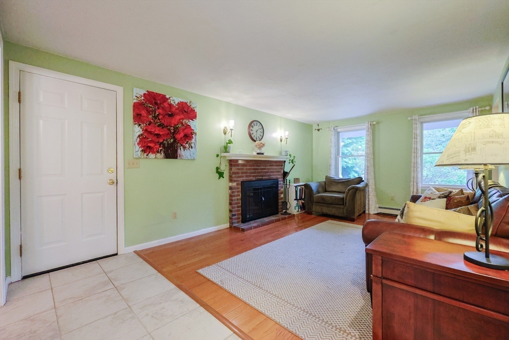 4 Rainbow Drive Medway, MA 02053 - Photo 13 of 42 a view of a livingroom with furniture and a fireplace