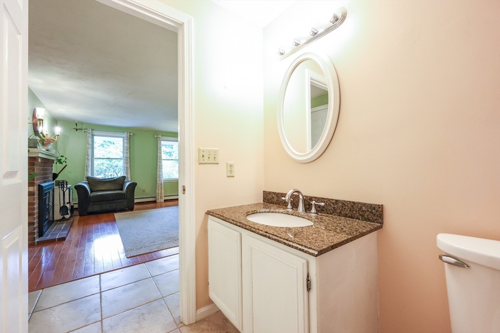 4 Rainbow Drive Medway, MA 02053 - Photo 16 of 42 a en suite bathroom with a granite countertop sink and a mirror