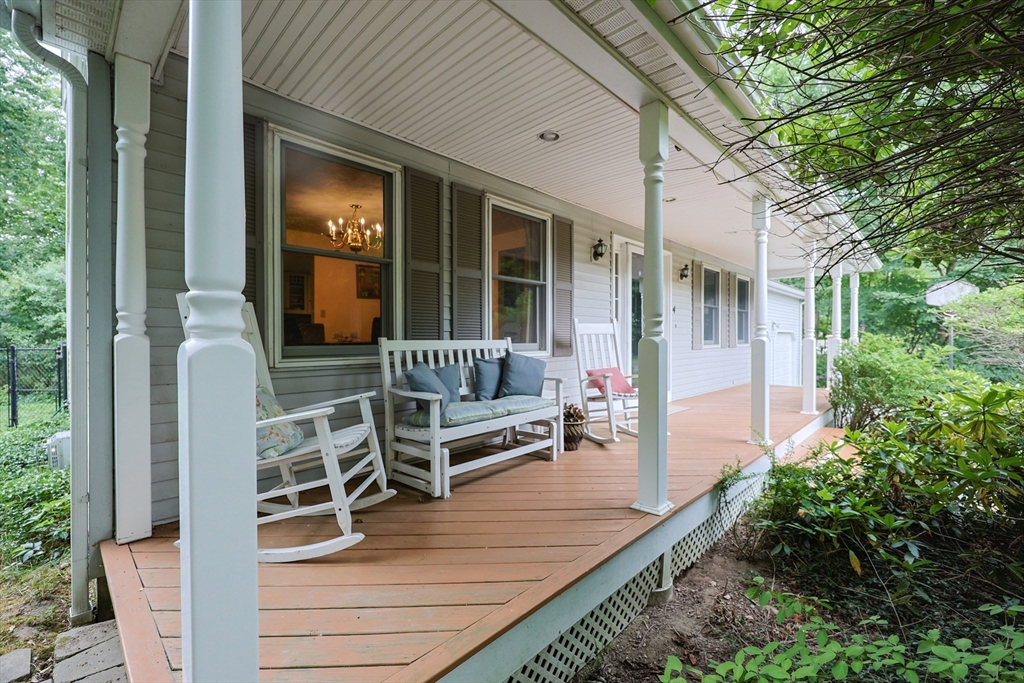 4 Rainbow Drive Medway, MA 02053 - Photo 2 of 42 a view of a patio with table and chairs with wooden floor and plants